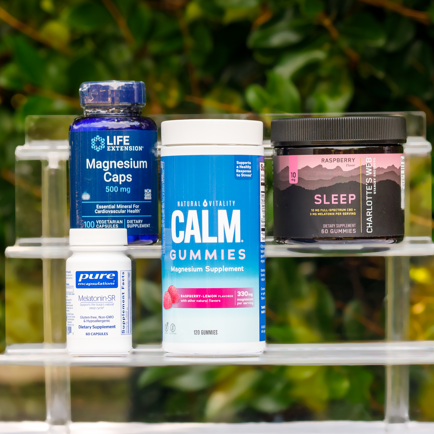 white bottle of sleep supplements sitting on a rock in nature